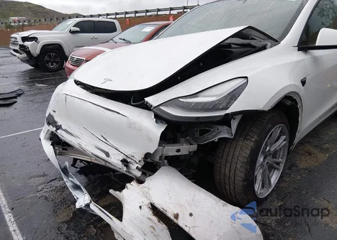 2022 Tesla Model Y Long Range Dual Motor All-Wheel Drive from USA, damaged, VIN 7SAYGDEE0NF350850